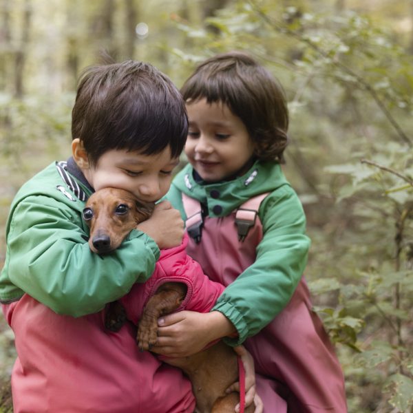 medium-shot-kids-holding-dog